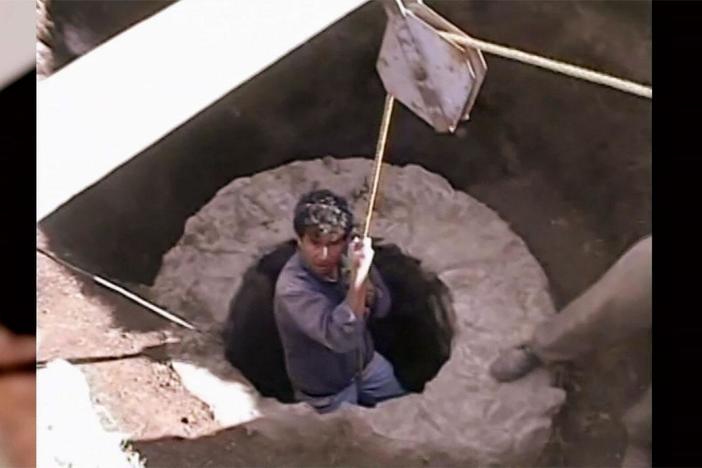 Archaeologists explore the tunnel below the Pyramid of the Feathered Serpent