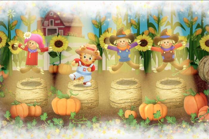 Daniel make believes he's a silly scarecrow.