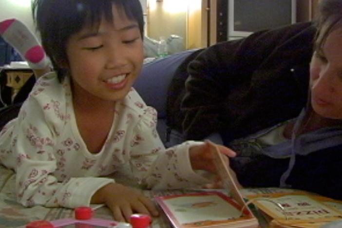 Faith tries to learn English with her new mother.