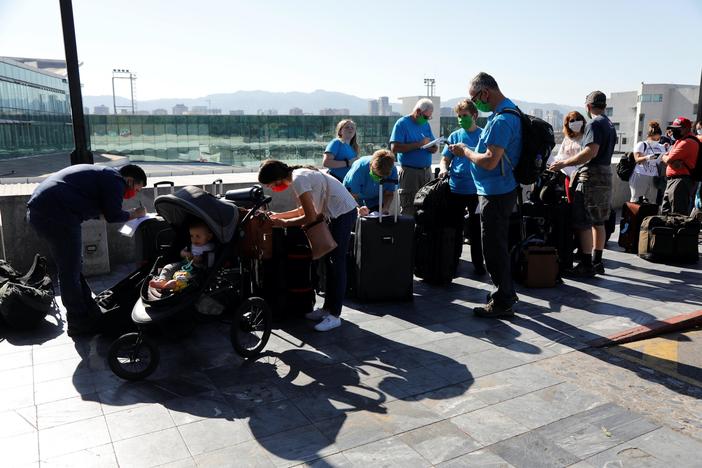 Americans stranded abroad try to escape border closures, overwhelmed health care systems