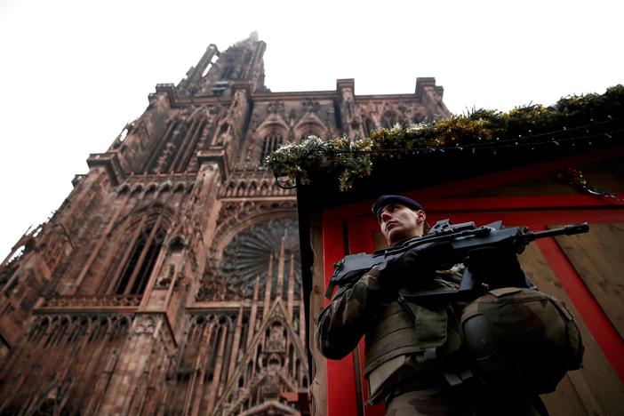 News Wrap: Gunman in French Christmas market attack still at large
