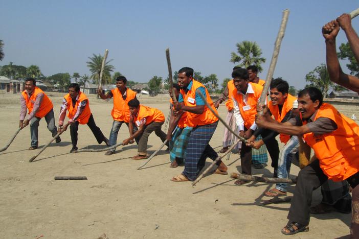 Volunteers help to save both tigers and human lives by scaring away tigers. 