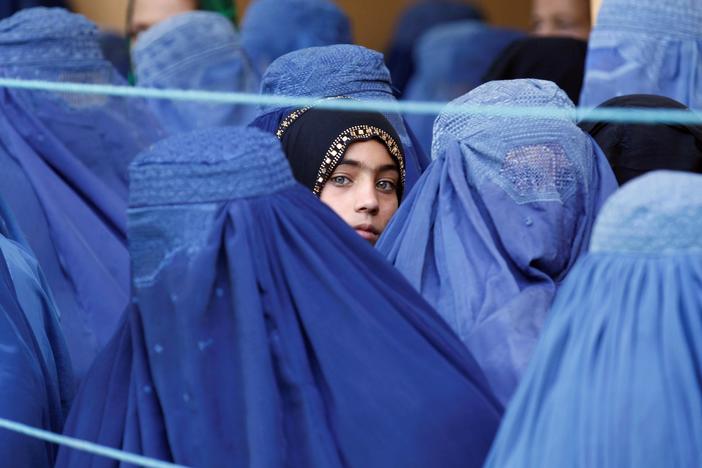 Taliban further restricts women's rights, forcing aid groups to halt work in Afghanistan