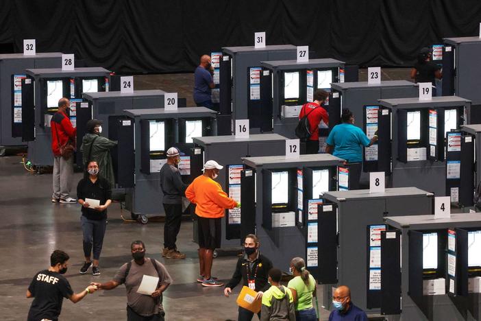 Despite pandemic, Georgia residents flock to the polls for early voting