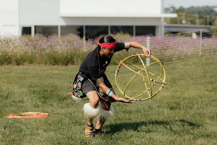 Two-spirit performance artist Ty Defoe performs "Hoop Dance."