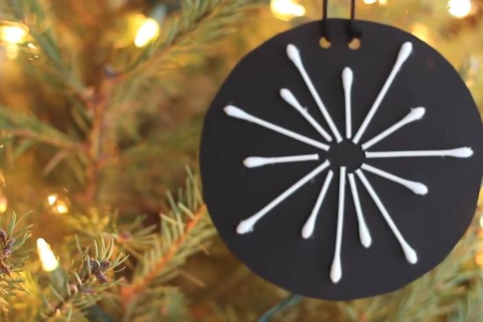 Decorate your house with these easy cotton swab snowflakes.
