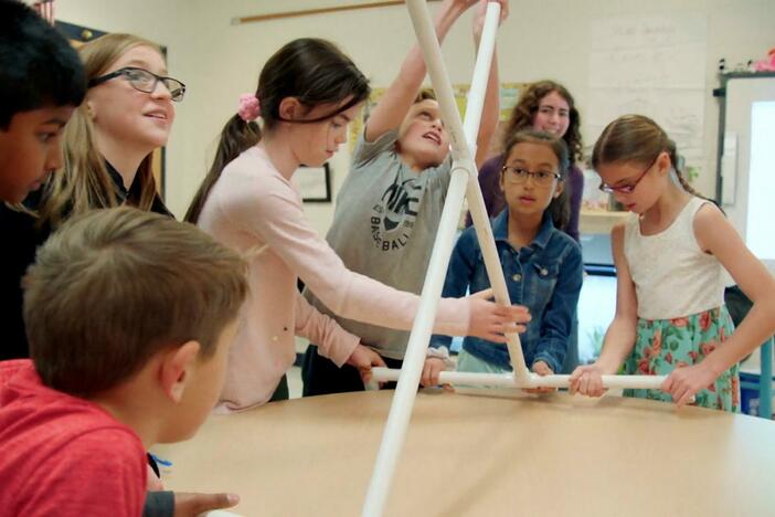 Ellie White visits an elementary school to lead students in an astronomy project.