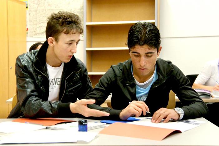 One teacher prepares his students for their new life in Switzerland.