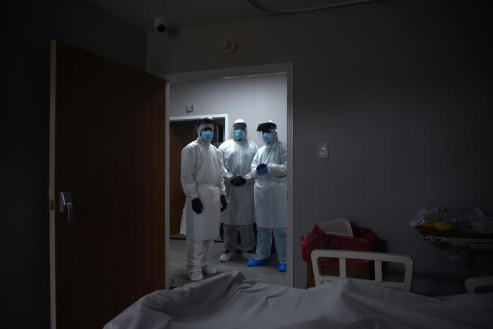 In states where coronavirus is surging, reopening plans put on hold