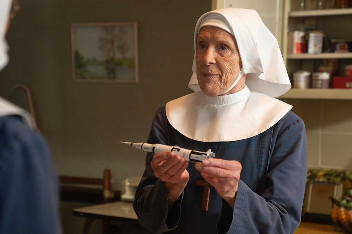 Sister Monica Joan's excitement for the moon landing leads her to keep a toy.