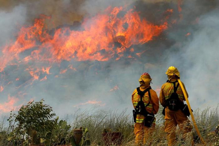 Wildfires in western states are disrupting efforts to curb air pollution