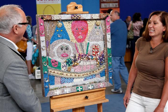 Ken Farmer appraises an "outsider art" picture by Simon Sparrow. 