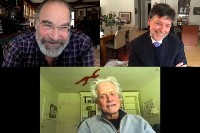 Ken Burns speaks with Mandy Patinkin and Michael Douglas.