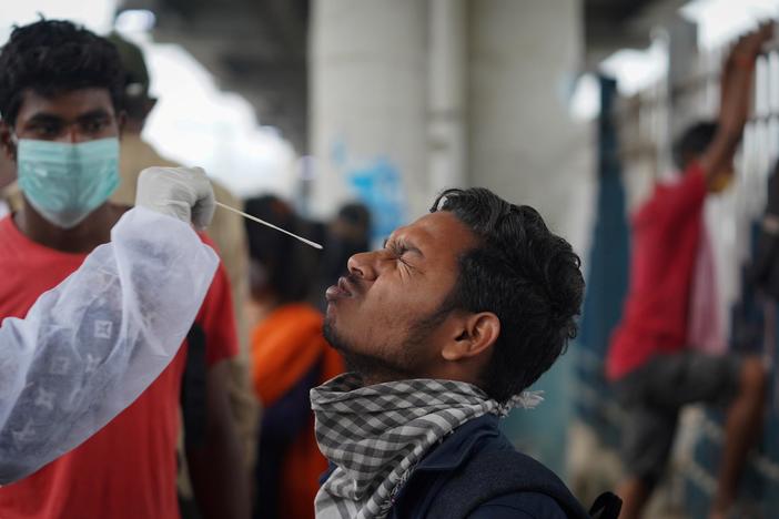 India extends door-to-door vaccine campaign as omicron variant worries officials