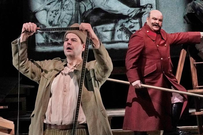 Wozzeck (Peter Mattei) discusses virtuousness with the Captain.