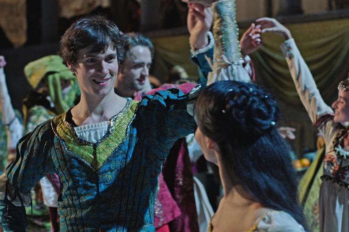 Romeo and Juliet share a secret dance at the party until Tybalt interrupts.