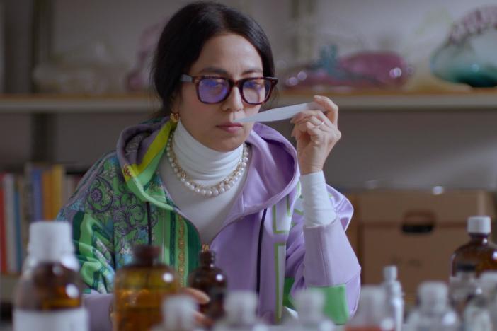 Artist Anicka Yi working with a team of experts in her studio and during the installation.