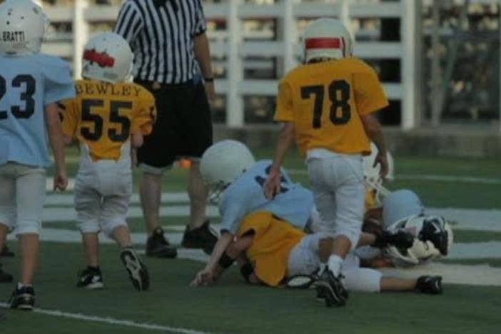 You would think first-grade summer football is just organized chaos, but you'd be wrong.