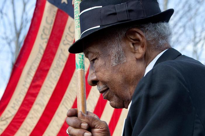 An Alabama barber celebrates the election of the first black president.