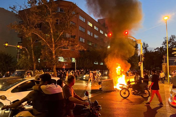 Protests erupt in Iran after death of woman arrested for violating dress code