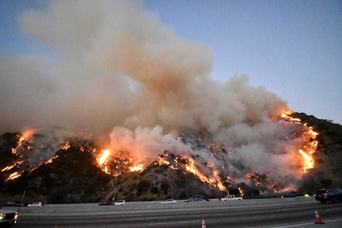 Windy conditions keep California burning -- and its power out