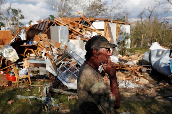 Amidst dark and debris, relief operations seek to sustain hurricane survivors