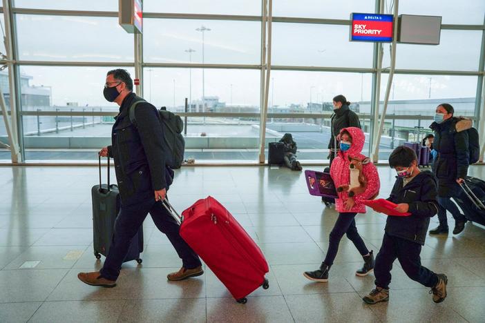 COVID-19 spreads holiday misery, as canceled flights strand thousands on Christmas Eve