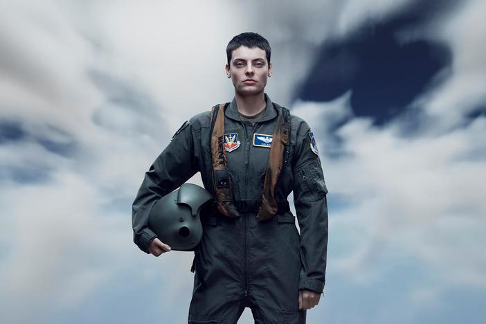 Follow a fighter pilot who operates a drone in a high-tech world battling both war and motherhood.