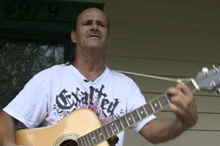 Watch fisherman Tilden Perez, Jr. perform a song on his guitar.