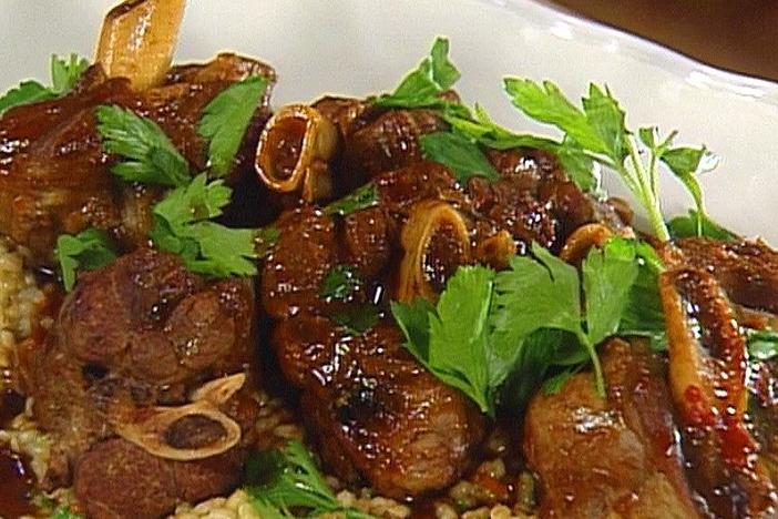 Chef Joachim Splichal prepares braised lamb shank on barley risotto.