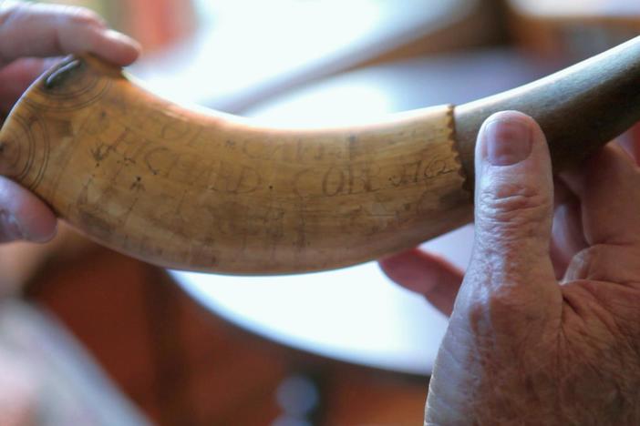 What is the story behind an engraved horn found in a Minnesota field?