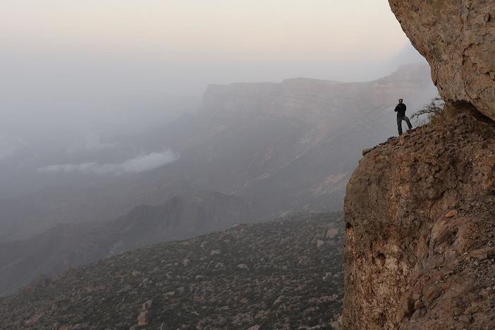 Steve takes the opportunity to explore the cliff camp.