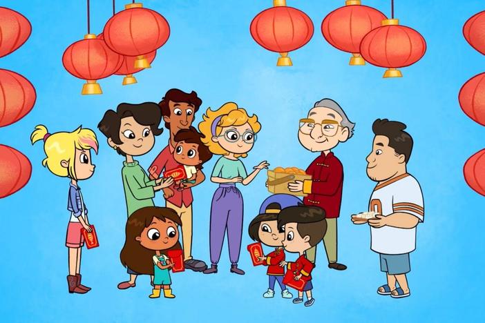 Jun, Quinn and Rosie do the Dragon Dance with Grandpa Liu