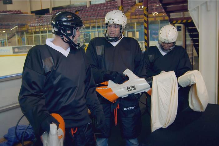 A hockey team demonstrates how galaxies expand, with some unusual equipment.