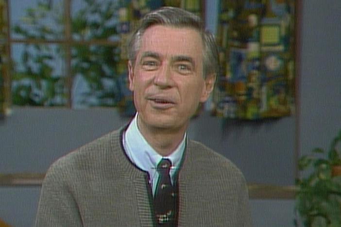 Mister Rogers talks about how his sister was adopted and that made him a brother.