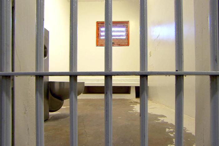 What are some of the ethical challenges raised by the long-term isolation of inmates?