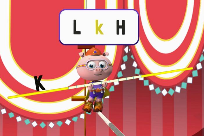 Alpha Pig uses his Alphabet Balancing Pole to walk across the tightrope.