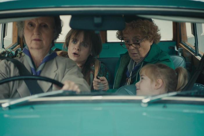 Miss Higgins, perennially a responsible driver, navigates Lindy to the maternity ward.