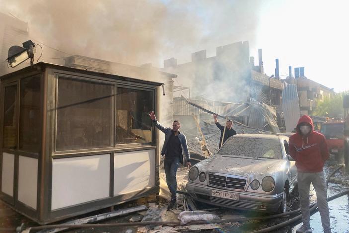 News Wrap: Syrian state media says Israeli airstrikes killed at least 15 people there
