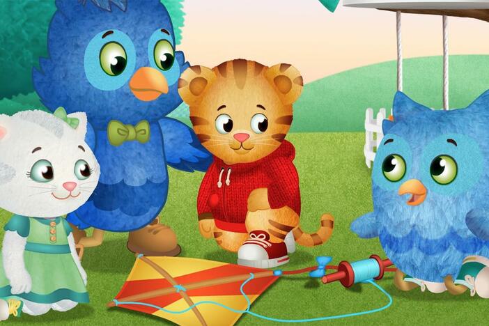 O is happy to play with a kite, but mad that he can't get it to fly. 