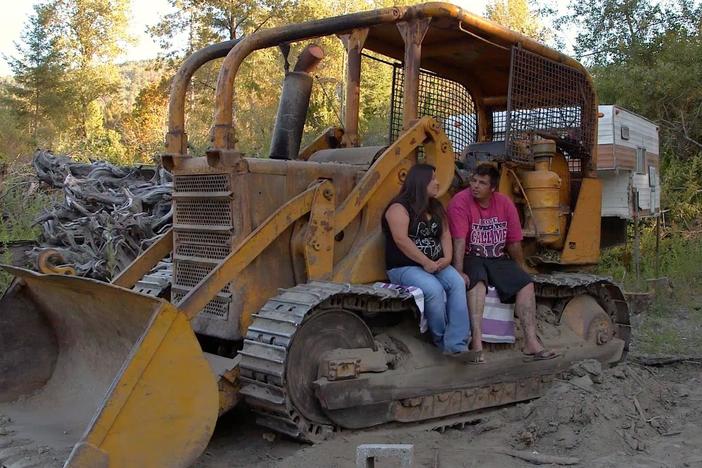 Taos works on building a house for his family. Abby encourages him to attain a GED.