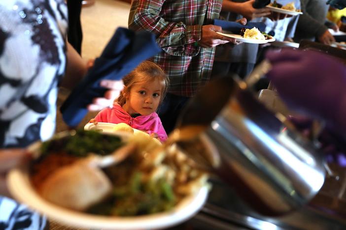News Wrap: Volunteers serve those affected by wildfire a holiday meal
