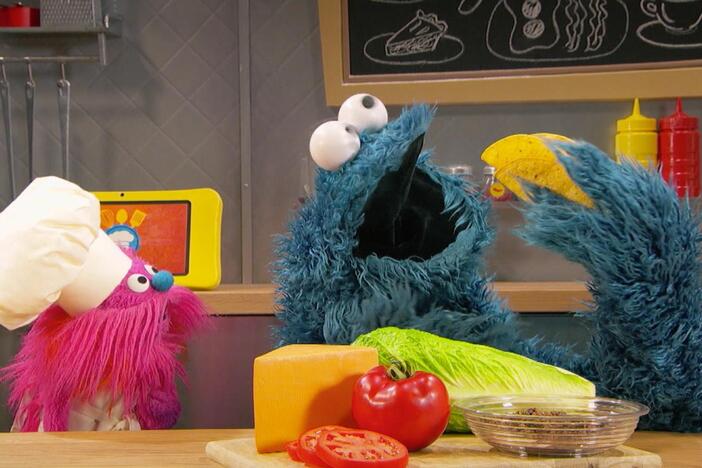 Cookie Monster and Gonger cook up some tacos.