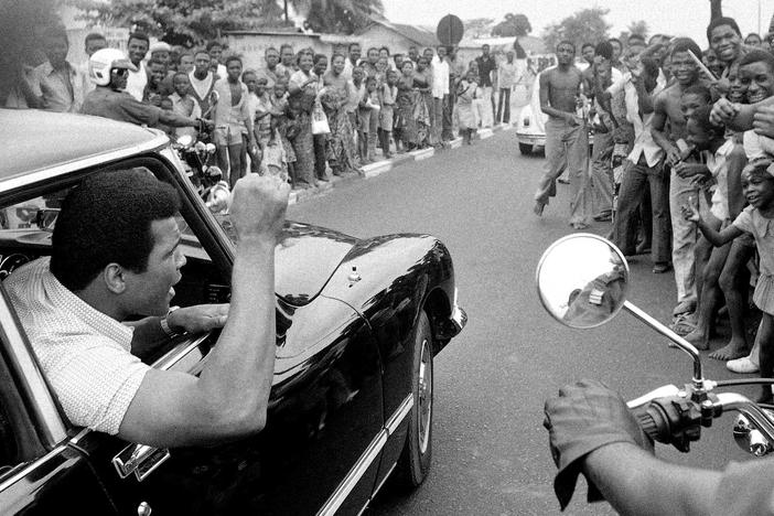 Muhammad Ali arrives to praise in Kinshasa where he would soon fight George Foreman.