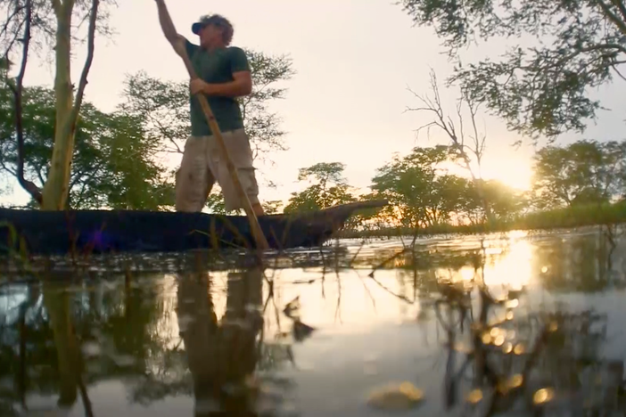 Bob Poole takes a tour in a traditional dugout canoe through Gorongosa's flooded forest.