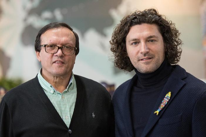 Michael and Fernando Benevides show off the bacalhau storeroom at Portugalia Marketplace.