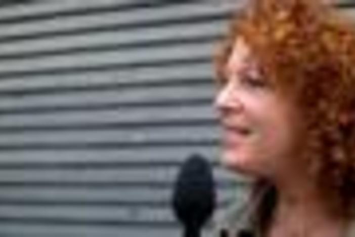 Harry Warners granddaughter talks to people on Hollywood Boulevard.