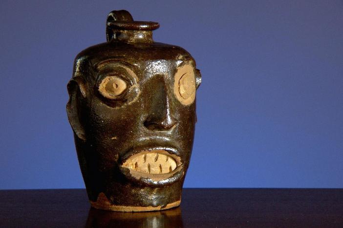 What does this ceramic face reveal about a captive people's search for identity?