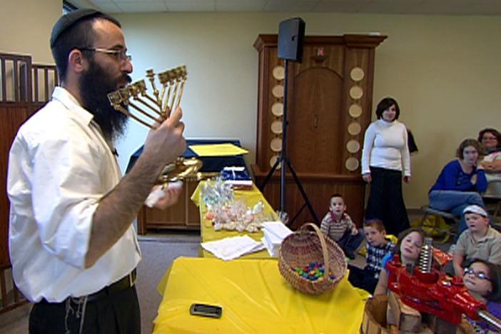Jewish children learn about the miracle of Hanukkah.