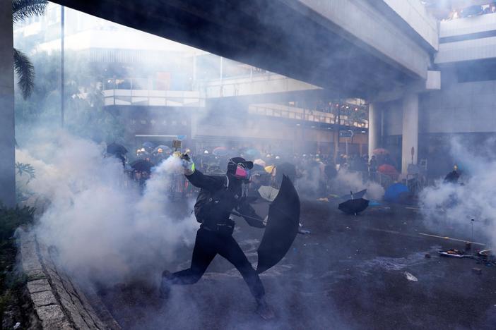 Hong Kong protest violence draws stark contrast to China’s anniversary pomp